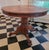 A rich, solid oak century old or more table with a lot of history and character. Refinish it if you must, but it is...