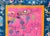 A wonderful early 20th century Chinese Art Deco rug with a brilliant fuchsia field surrounded by thin orange, wide indigo,...