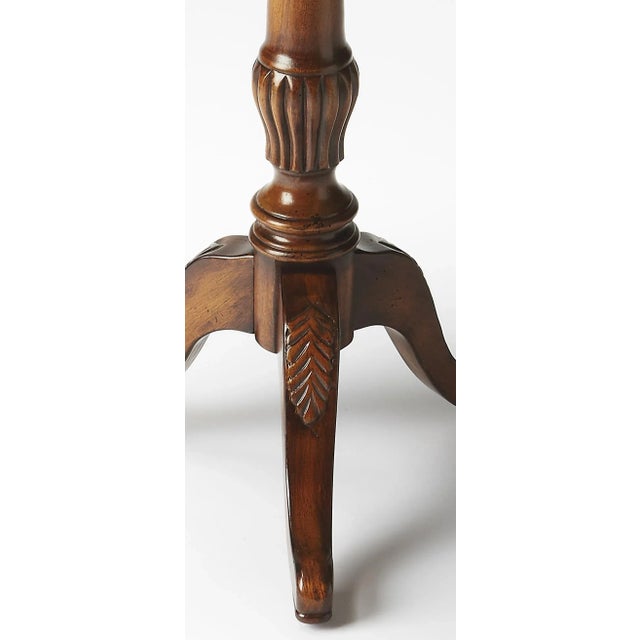 Add a touch of traditional sophistication to home decor with this lovely round pedestal table. Crafted of solid Woods,...