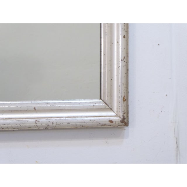 This 19th Century Silverleaf mirror has a lightly distressed finish and measures 27.5"H x 22"W.