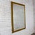 Magnificent vintage Neoclassical to Traditional large sized wall mirror with a rectangular antique gold gilded frame....