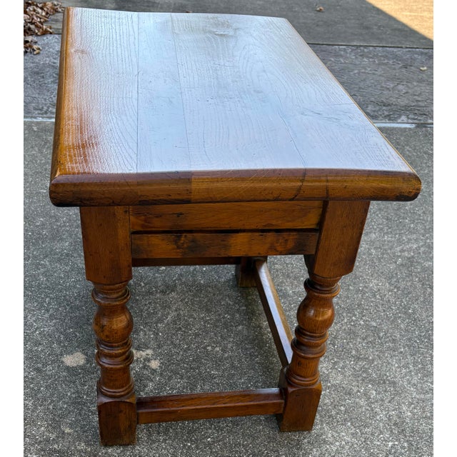 Nice vintage side table with one drawer and turned legs. Solid wood