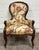 This is a gorgeous antique Victorian Rococo Revival walnut balloon-back armchair or parlor chair featuring a dramatic...