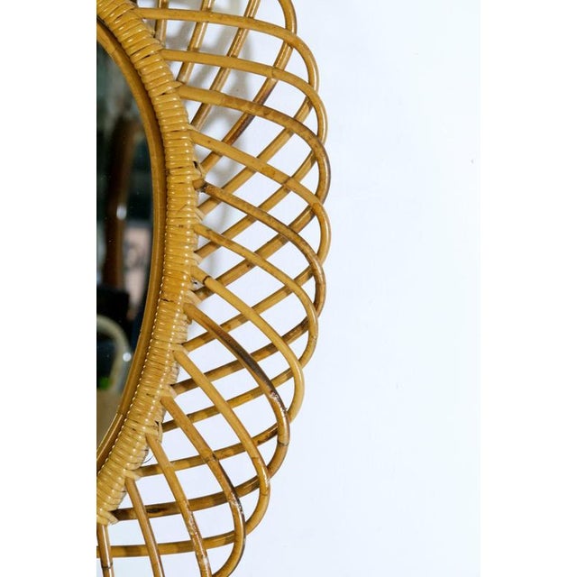 Mid-Century Italian handmade rattan wall mirror in very nice original condition without damages.
