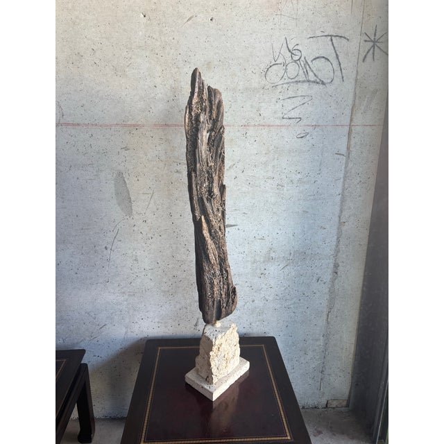Striking late 20th century studio-made coastal sculpture composed of natural driftwood mounted on a solid coral stone...