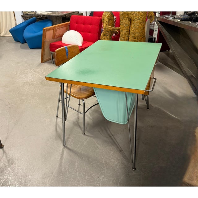 A very cool looking desk and matching chair designed by Kem Weber for Heywood Wakefield’s Trimline group. The desk has a...