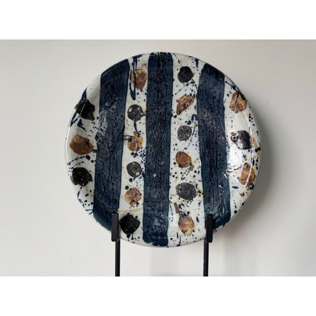 Striking original studio art ceramic plate by Josef Zala, dated 1987. This sculptural plate features a bold abstract...