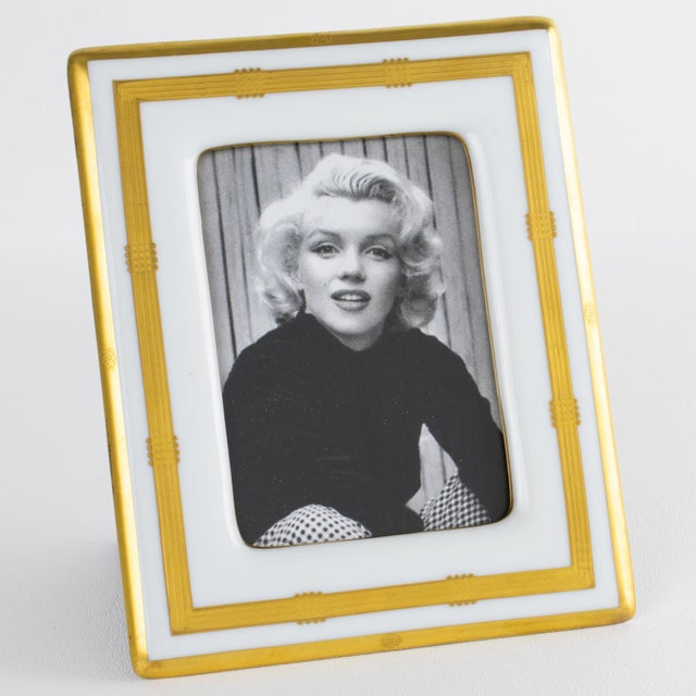 This spectacular Christian Dior Paris white and gilded ceramic picture frame is a rare piece from the Dior Interior...