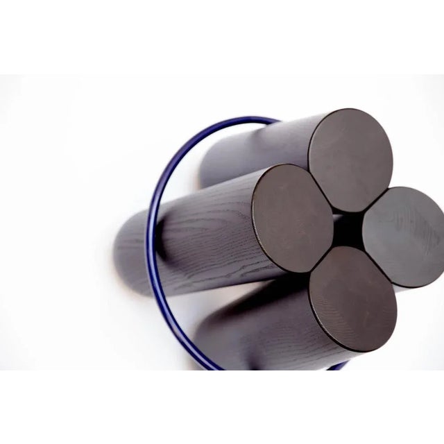 Bolt is a stool with a simple construction, four cylinders of solid wood are held together by a metal ring. The result is...