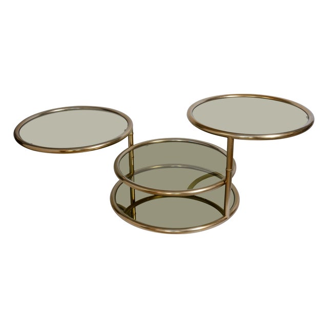 Just in! This is an iconic multi-tier space-saving accent table originally designed during the late 20th century. It...