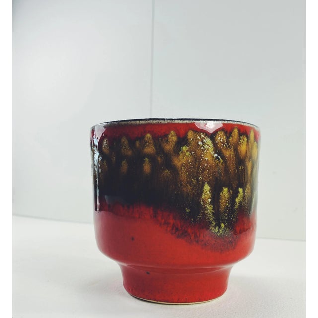 Vibrant red & caramel colored glazed jardiniere. Made in Belgium. Circa 1960s