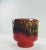 Vibrant red & caramel colored glazed jardiniere. Made in Belgium. Circa 1960s