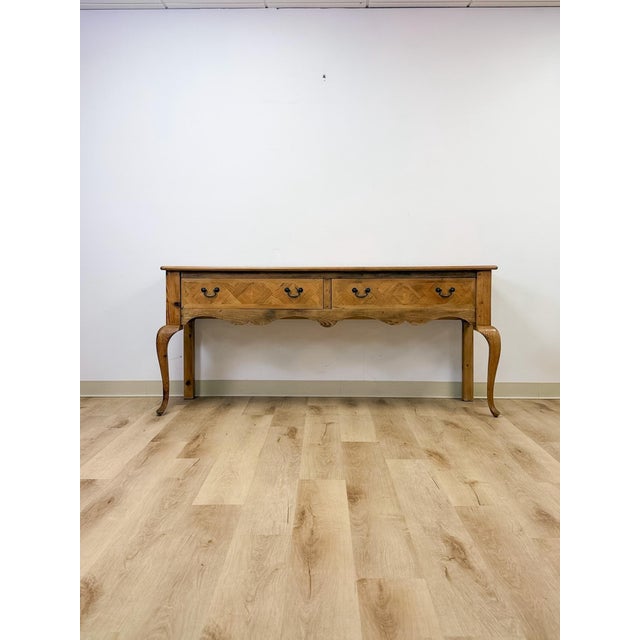 This handmade console table showcases genuinely collectible craftsmanship, combining solid pine construction with detailed...