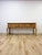 This handmade console table showcases genuinely collectible craftsmanship, combining solid pine construction with detailed...