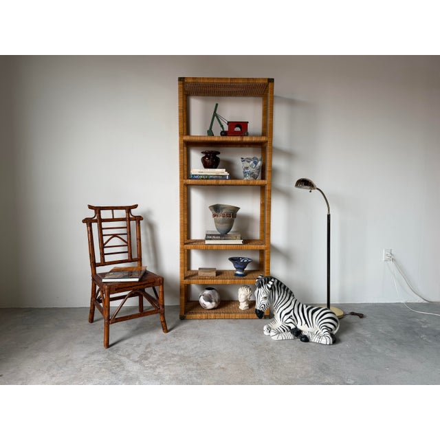 Bring timeless coastal elegance to your space with this vintage Bielecky Brothers-style wrapped rattan six-tier etagere....