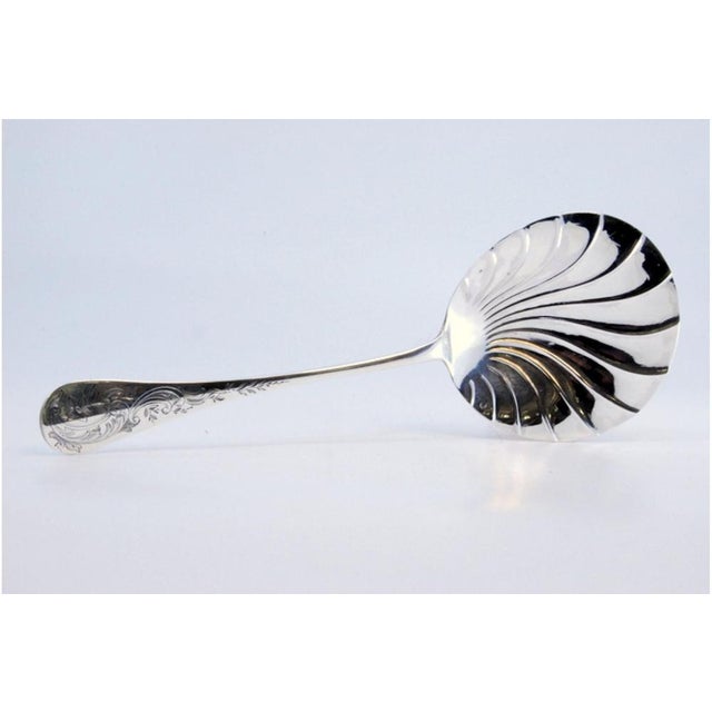 Silver Dessert Spoon with Leaf-Shaped Shell, in Very Good conditions. Designed before 1890 This piece has an attribution...