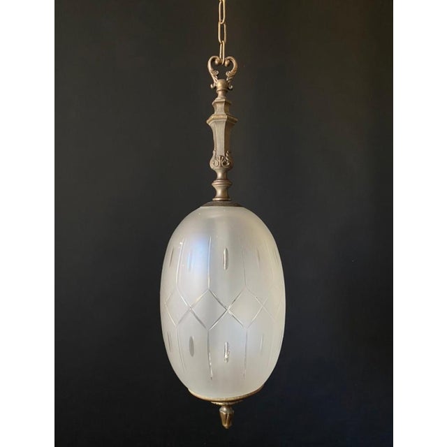 Elegant antique chandelier. italy, 20th century. the chandelier is made of beautiful frosted glass with ornamentation. It...