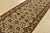 An authentic Agra runner hand-knotted with fine wool on a cotton foundation. This rug features a botanical design set...
