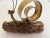 Adorable 1970s snail sculpture hand crafted of torch cut metal in shades of copper and gold with a flexible kinetic ribbon...