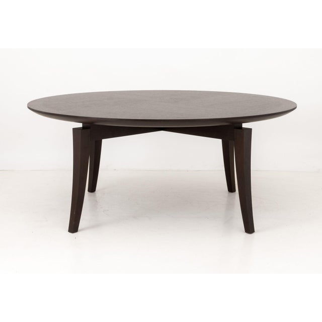 Romeo Sozzi Attributed Ebonized Wood Modern Circular Dining Table, the circular top above four ebonized wood tapered legs....