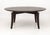 Romeo Sozzi Attributed Ebonized Wood Modern Circular Dining Table, the circular top above four ebonized wood tapered legs....