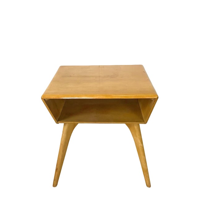 Exude curated architectural sophistication with this masterfully executed mid-century modern side table, produced by the...