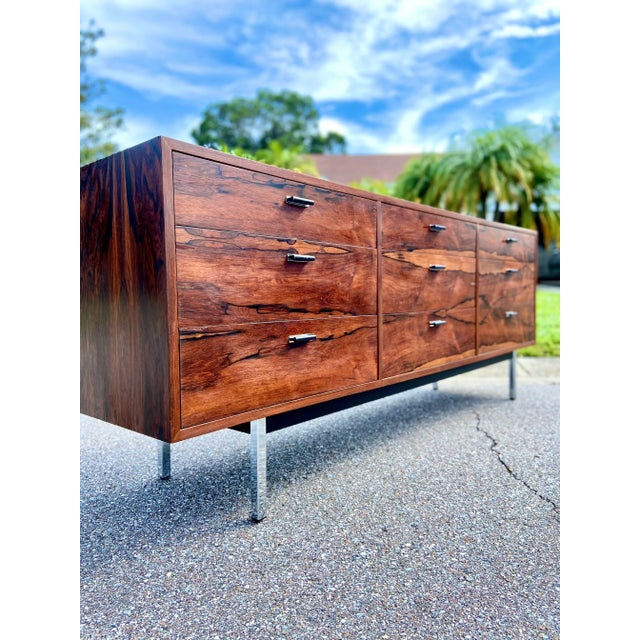 The wood grain could not get better than this! What a stellar piece to add to your modern collection. This has an elegant...