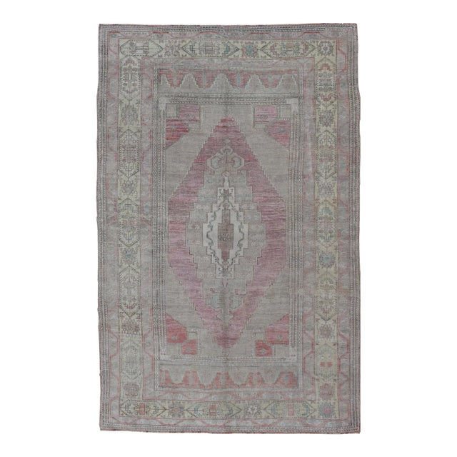 Mid 20th Century Vintage Turkish Oushak Rug With Layered Medallion Design in Light Pink and Cream For Sale