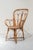 Pair of bamboo chairs with arms. Bamboo structure with round mesh seat and curved backrest.