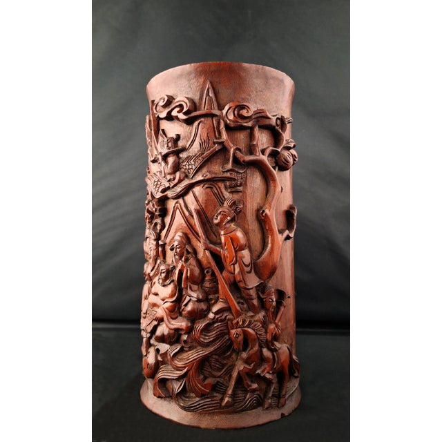 Chinese bamboo Eight Immortals bitong, a sleeve form, bamboo brushpot, decorated with finely carved Eight Immortals in...