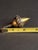 Curator’s Note: This masterfully crafted object exists at the intersection of historical toy and fine metalwork. Its...