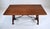 20th century Spanish fold out dining table with banded top, two dovetail drawers and hand forged Iron stretcher. Versatile...