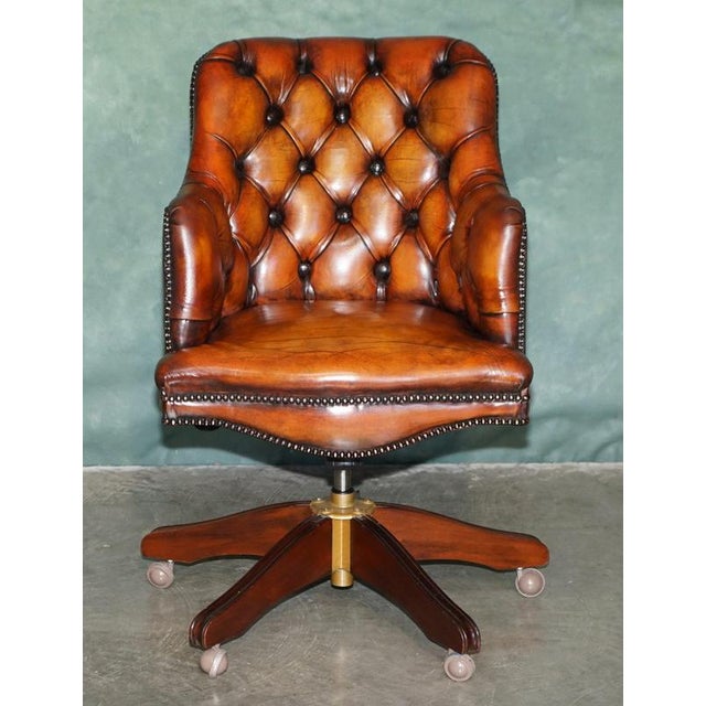 Handsome vintage Chesterfield Tufted leather Captain's desk or office chair, dating to the latter part of the 20th...