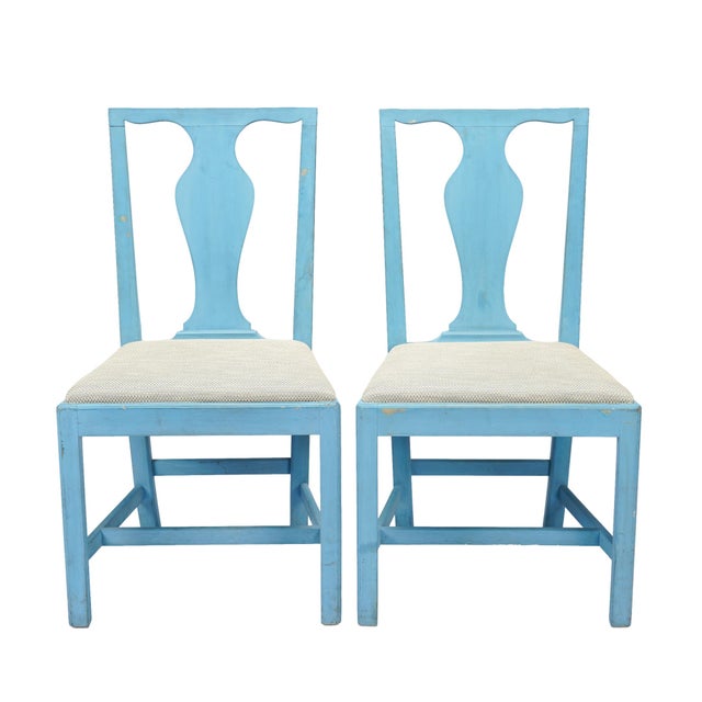 A pair of American Academic Revival mahogany slip-seat side chairs, made after an 18th-century model, finished in a blue...