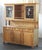 Elevate your dining space with this exceptional Mid-Century Modern Light Oak Display Cabinet / China, a true testament to...