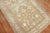mid-20th century Persian rug in light brown, accents in white and light blue Measures: 3'5" x 6'5".