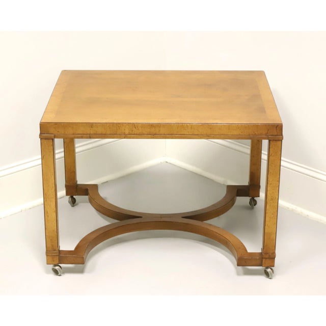 A Neoclassical style rectangular side table by Tomlinson Furniture. Walnut with burlwood banding to top, slightly...