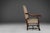 This 19th-century magnificent throne chair is made of oak wood and upholstered in fabric with an ornate motif. The wood is...