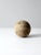 This is an antique softball. The large leather softball is likely from the early years of the game. Beautiful wear to the...