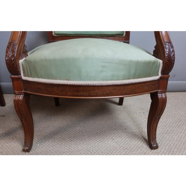 Restoration period living room set comprising four armchairs and two chairs in molded and carved wood. These pieces are in...