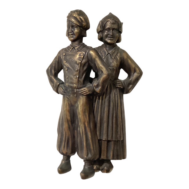 Vintage Pair of Cast Iron Andirons of a Colonial Dutch Boy & Girl Figurines For Sale