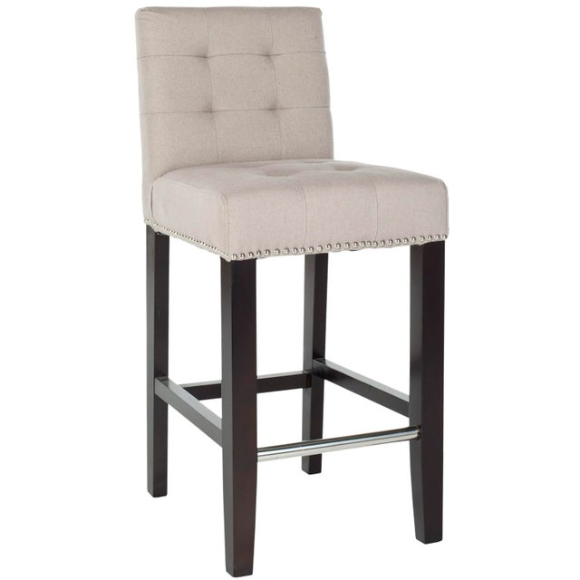 the counter Stool offers classic design and sumptuous comfort for traditional or transitional interiors. Featuring a...
