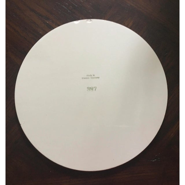 Two black, yellow, and white fish accent this porcelain plaque, dish, or trivet. Marked: Make in Western Germany 387....