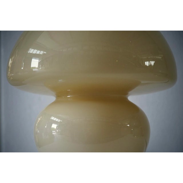 Precious and unique hand-blown cream colored Murano glass, with a classic but original design, a shape that resembles a...