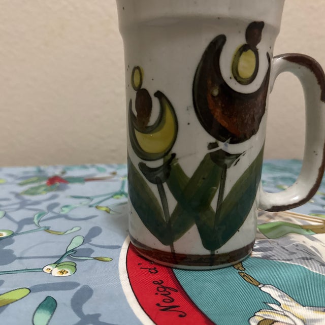 Bring an authentic slice of Mid-Century design to your collection with this striking, hand-painted ceramic stoneware mug....