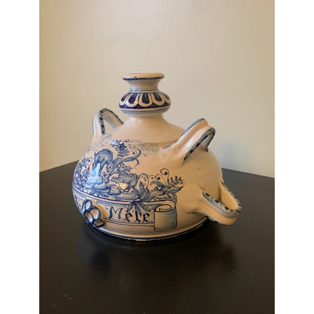 A beautiful hand painted blue and white faience pottery jug or vase with handles featuring dogs hunting a deer By Deruta...