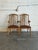 This vintage set of 2 armchairs features an elegant high-back silhouette with subtly curved armrests and contoured back...