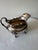 A distinguished antique Edwardian sterling silver sauce boat, hallmarked at the Glasgow Assay Office and bearing British...