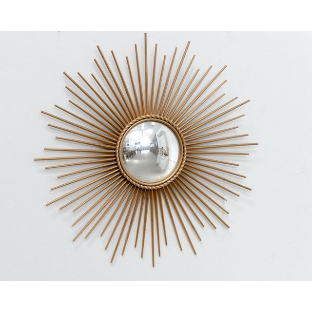 Chaty Vallauris sunburst mirror in gilt metal, with a convex mirror. An iconic piece of French design from the 1950s/60s....