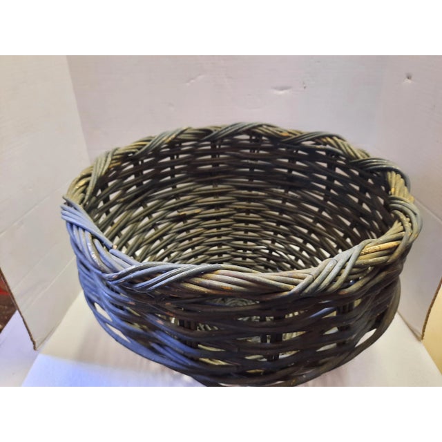 Large vintage French Basket. From the Brittany region of France. Solid and hand-woven. The finish has natural distressed...